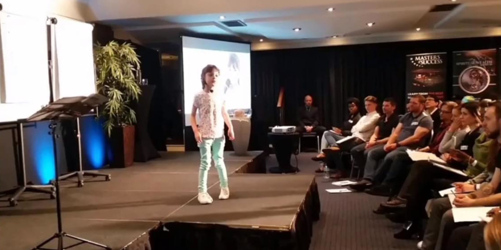 Tegan talking on stage